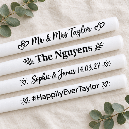Custom printed white glow sticks showing personalisation styles: Mr &amp; Mrs, family name, couple names and date, hashtag